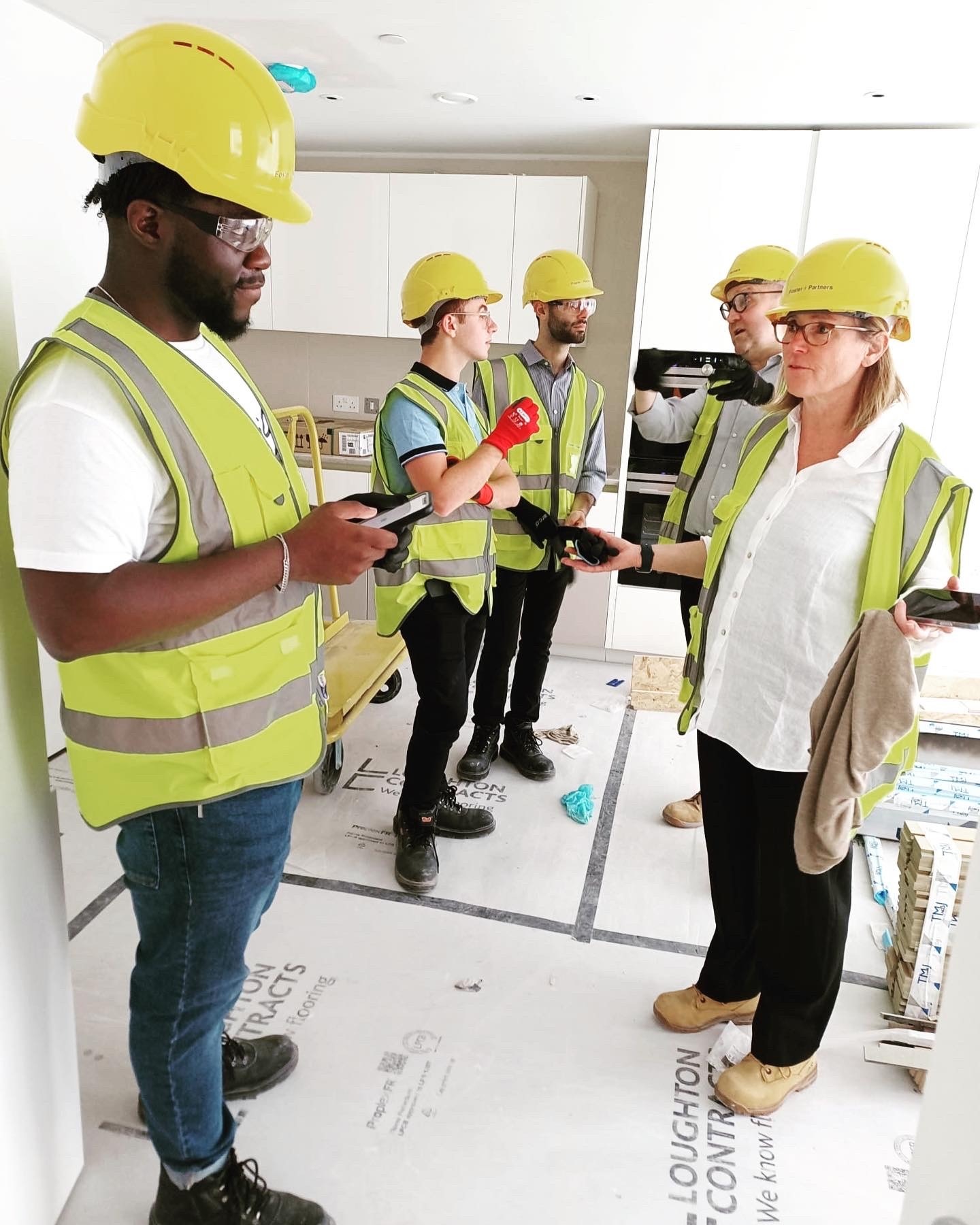 People with hi-vis jackets and hard hats on