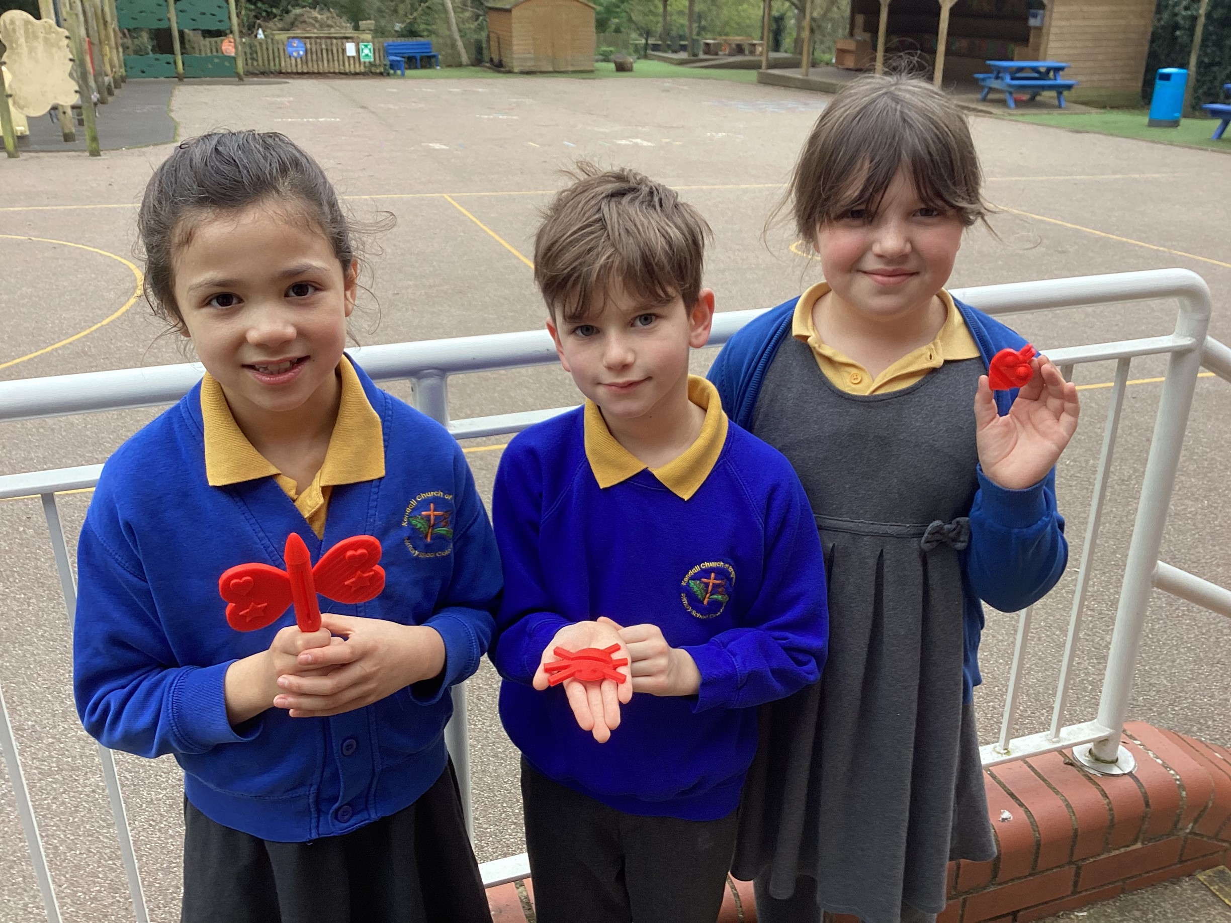 School children holding up a 3D printed object