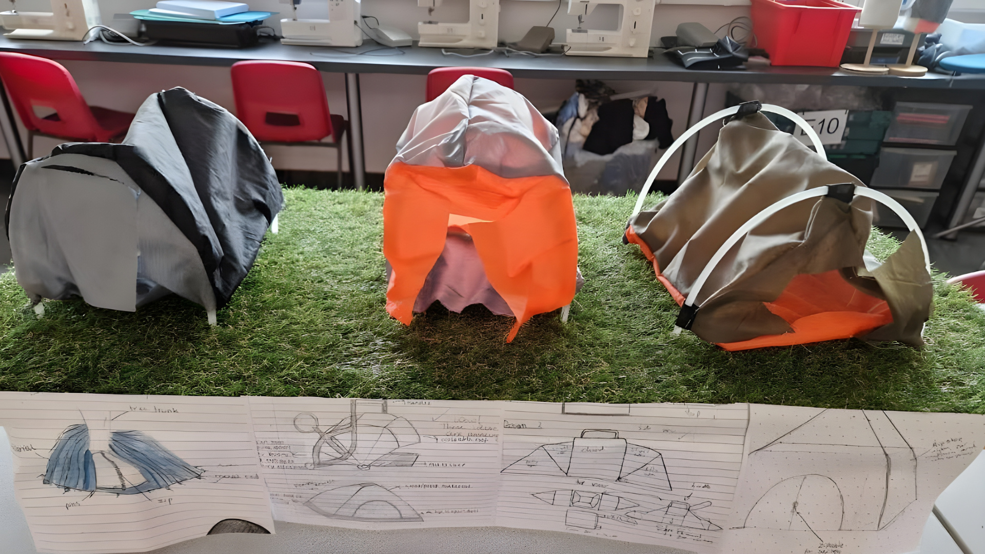 Student-designed short-term shelter prototypes displayed with design sketches in a classroom setting.