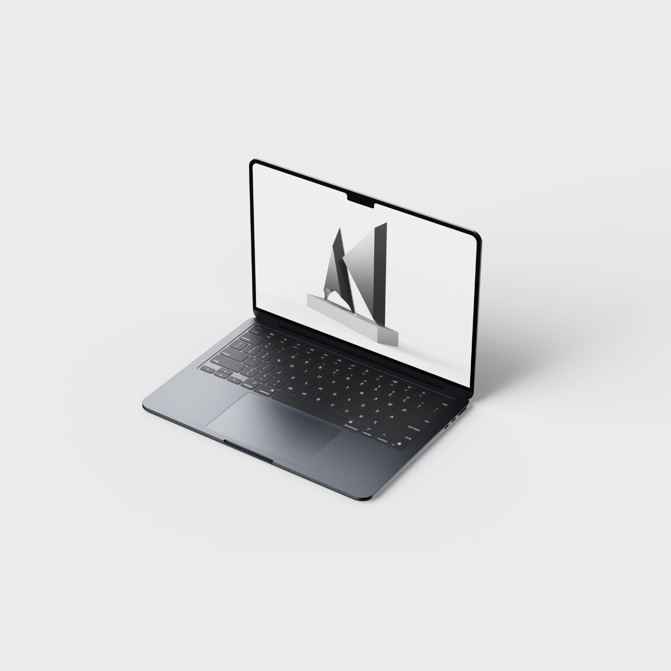 Laptop displaying a 3D CAD model of a modern abstract trophy design with angular forms