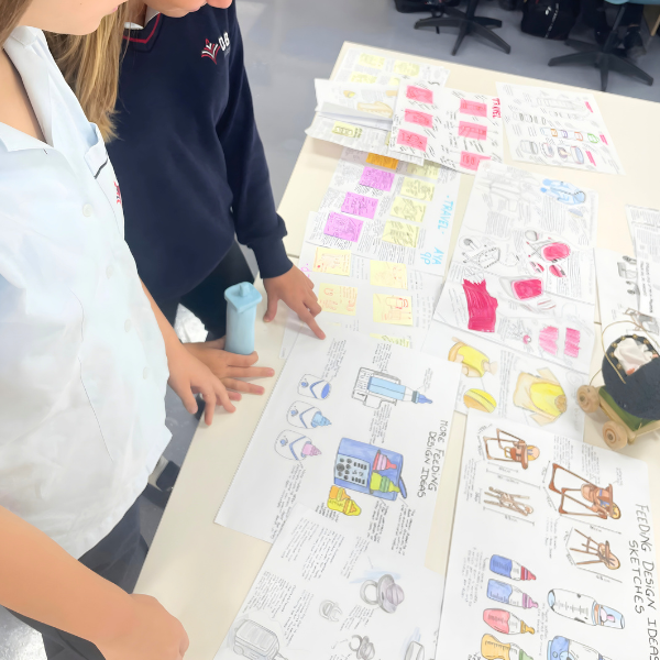 Students developing baby product design concepts in Mamas & Papas projectv