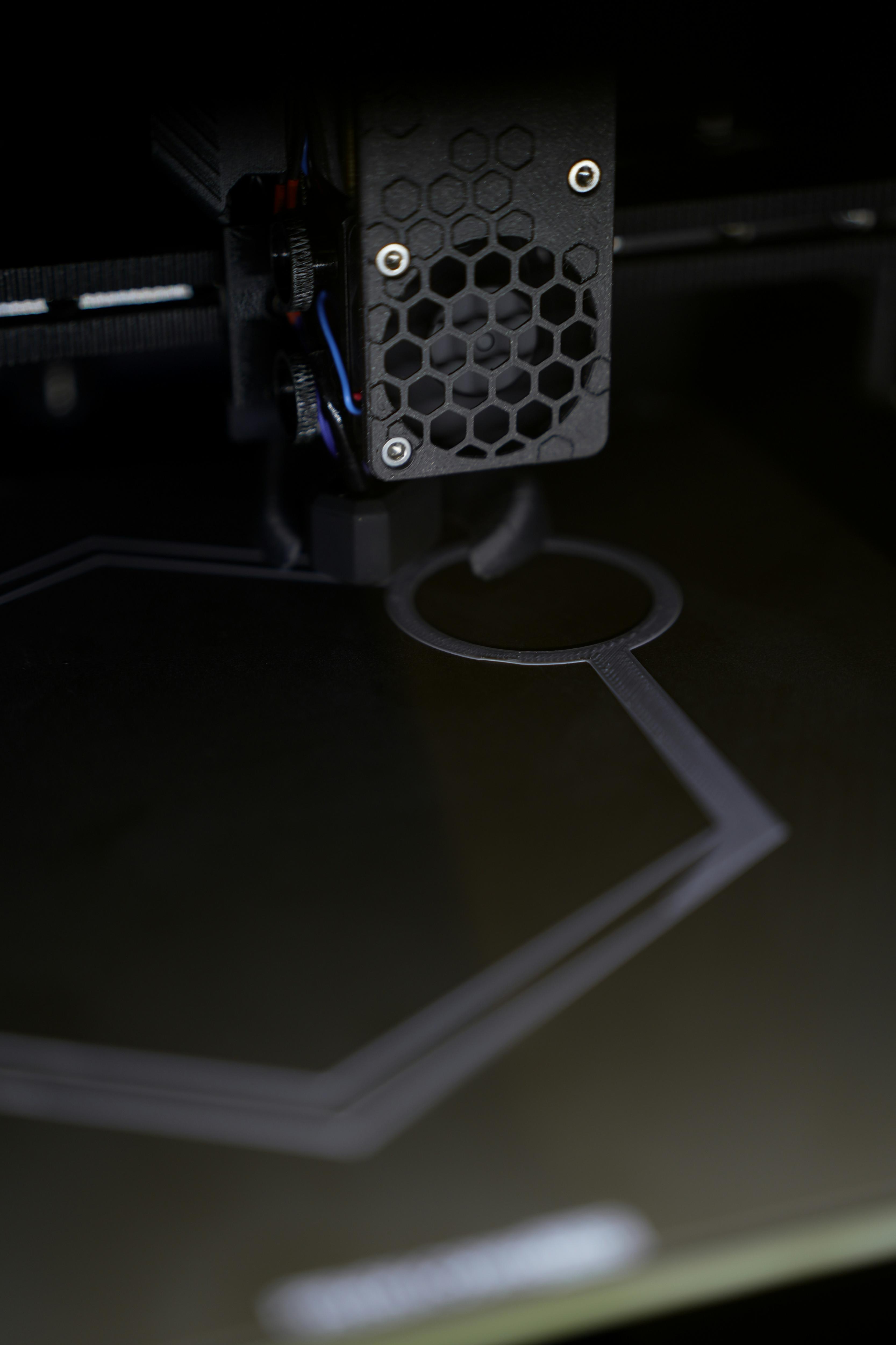 Close-up of a 3D printer producing a component during the additive manufacturing process for Design and Technology.