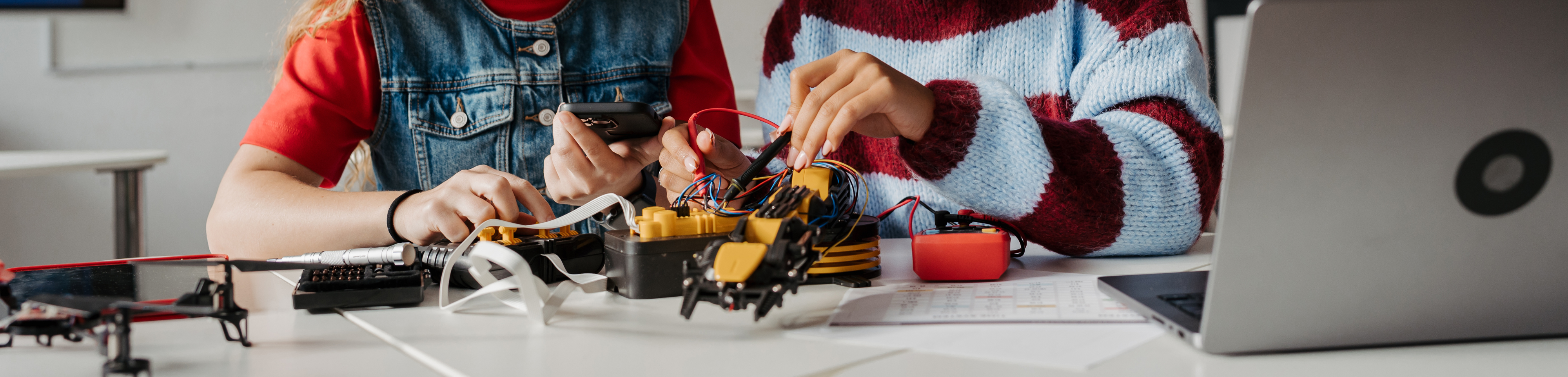 Teenage girls working on robotics