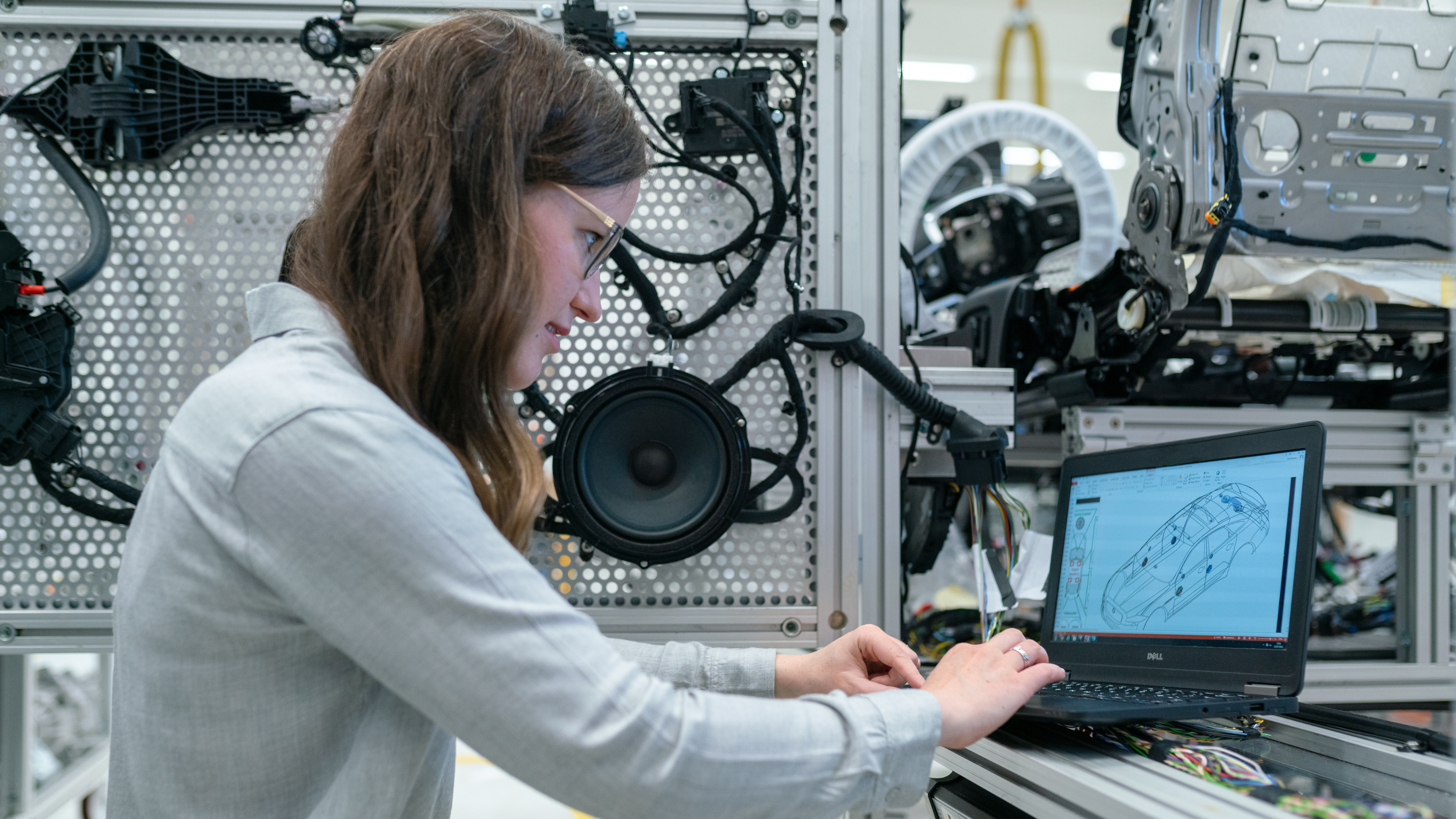 Female engineer working on CAD of a car