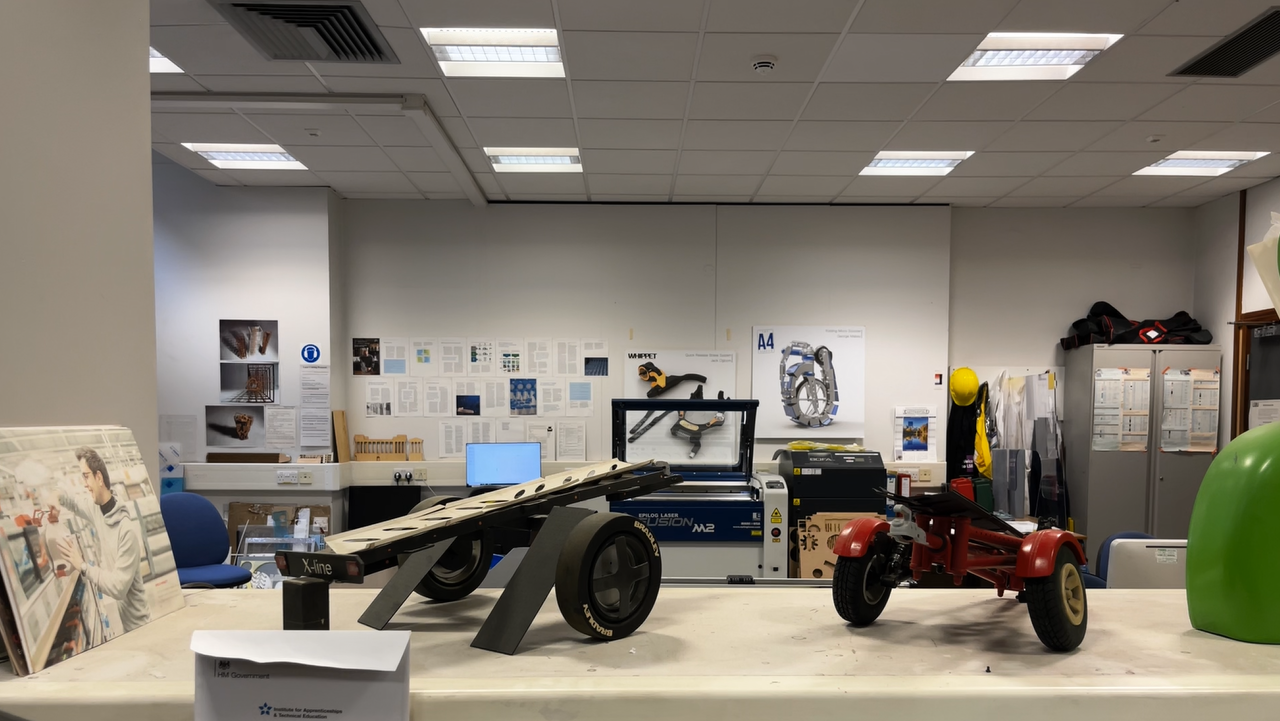 Engineering workshop with several vertical milling machines, workbenches and tooling, showing a machining space used for manufacturing and metalworking.
