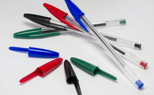 The image shows a group of pens in different colours and sizes, arranged together to highlight their variety.